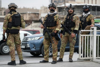 Des membres des forces du Hachd al-Chaabi irakien patrouillent à Bagdad, le 12 mars 2026 - - (AFP)